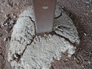 Rusted columns supporting a house 1